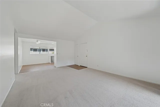 a view of empty room with windows