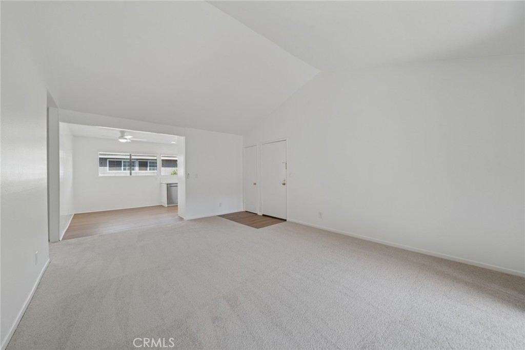 82 Streamwood Irvine, CA 92620 - Photo 9 of 26 a view of empty room with windows