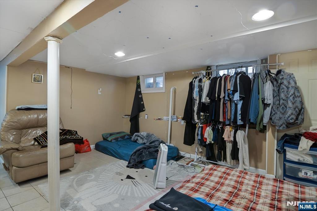 22 Tuttle Street Wallington, NJ 07057 - Photo 15 of 33 a walk in closet with clothes and shoes