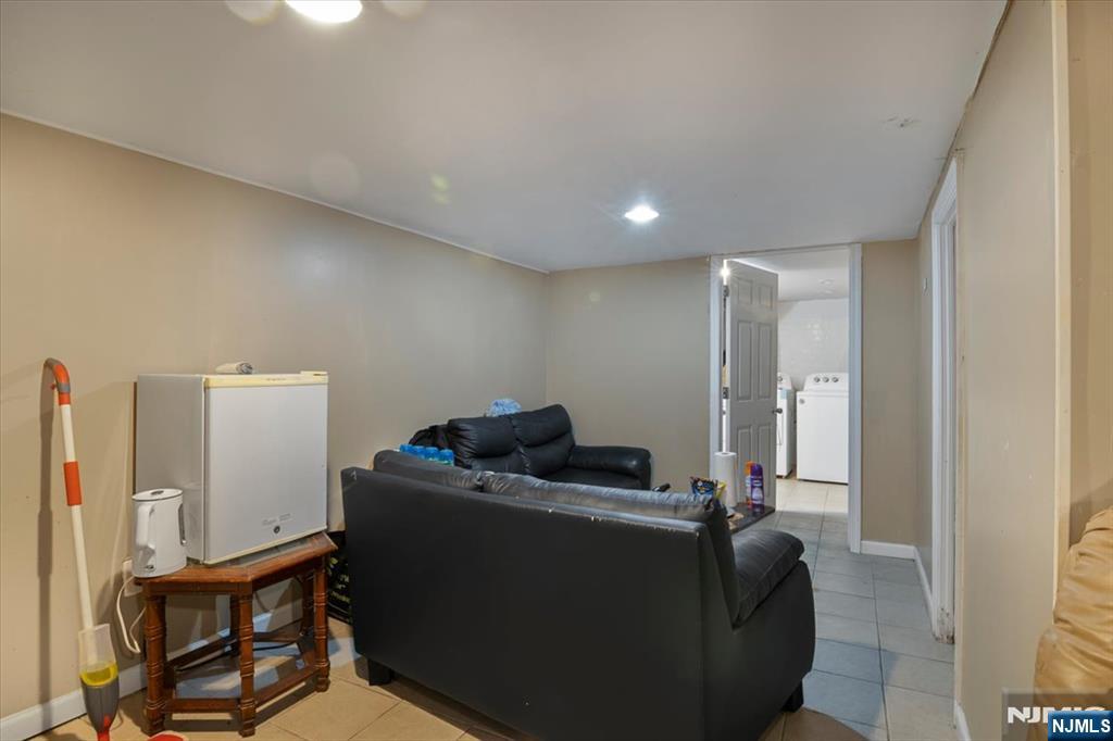 22 Tuttle Street Wallington, NJ 07057 - Photo 16 of 33 a living room with furniture and a window