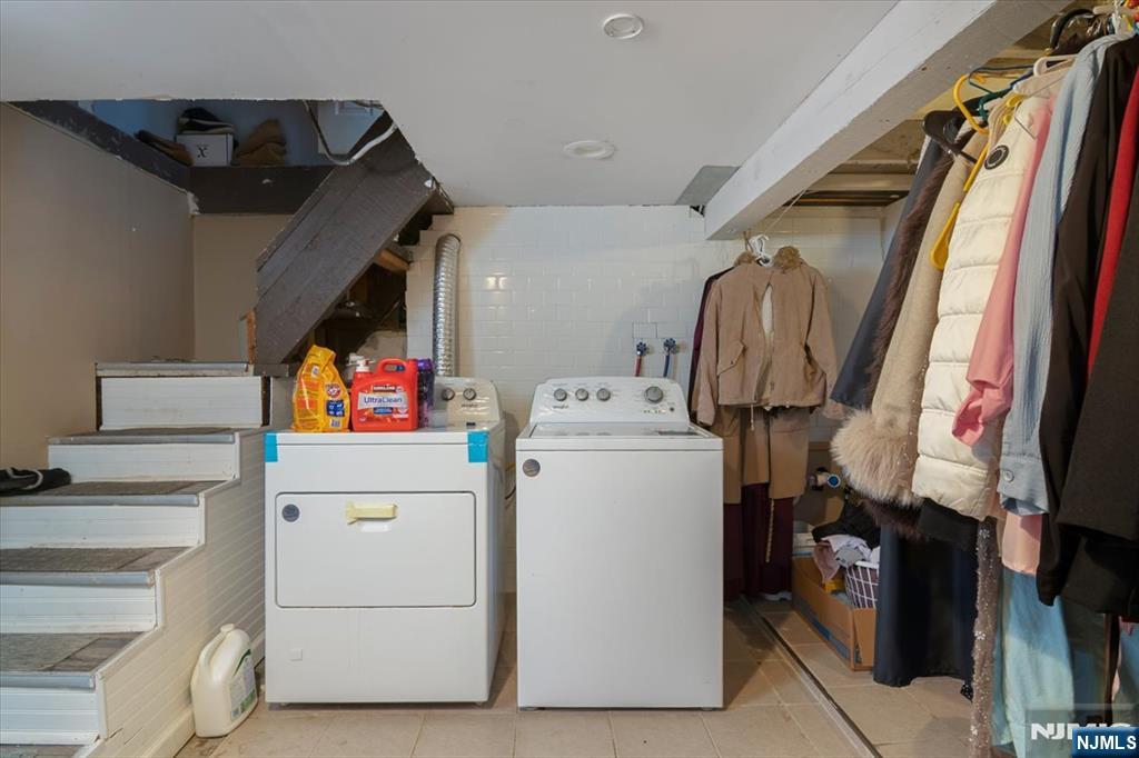 22 Tuttle Street Wallington, NJ 07057 - Photo 18 of 33 a utility room with dryer and washer