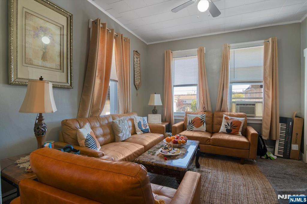 22 Tuttle Street Wallington, NJ 07057 - Photo 20 of 33 a living room with furniture and a large window