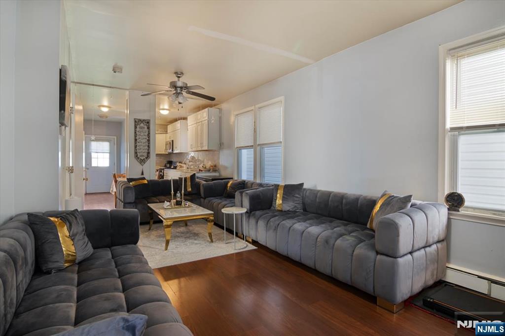 22 Tuttle Street Wallington, NJ 07057 - Photo 3 of 33 a living room with furniture and a large window