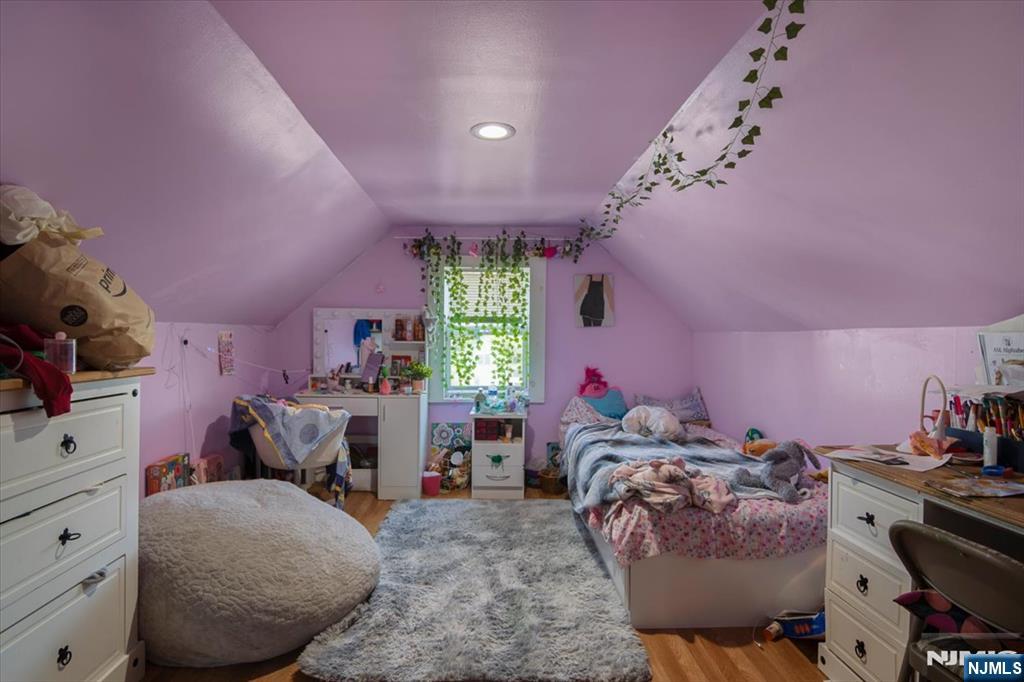 22 Tuttle Street Wallington, NJ 07057 - Photo 31 of 33 a bedroom with furniture and a window