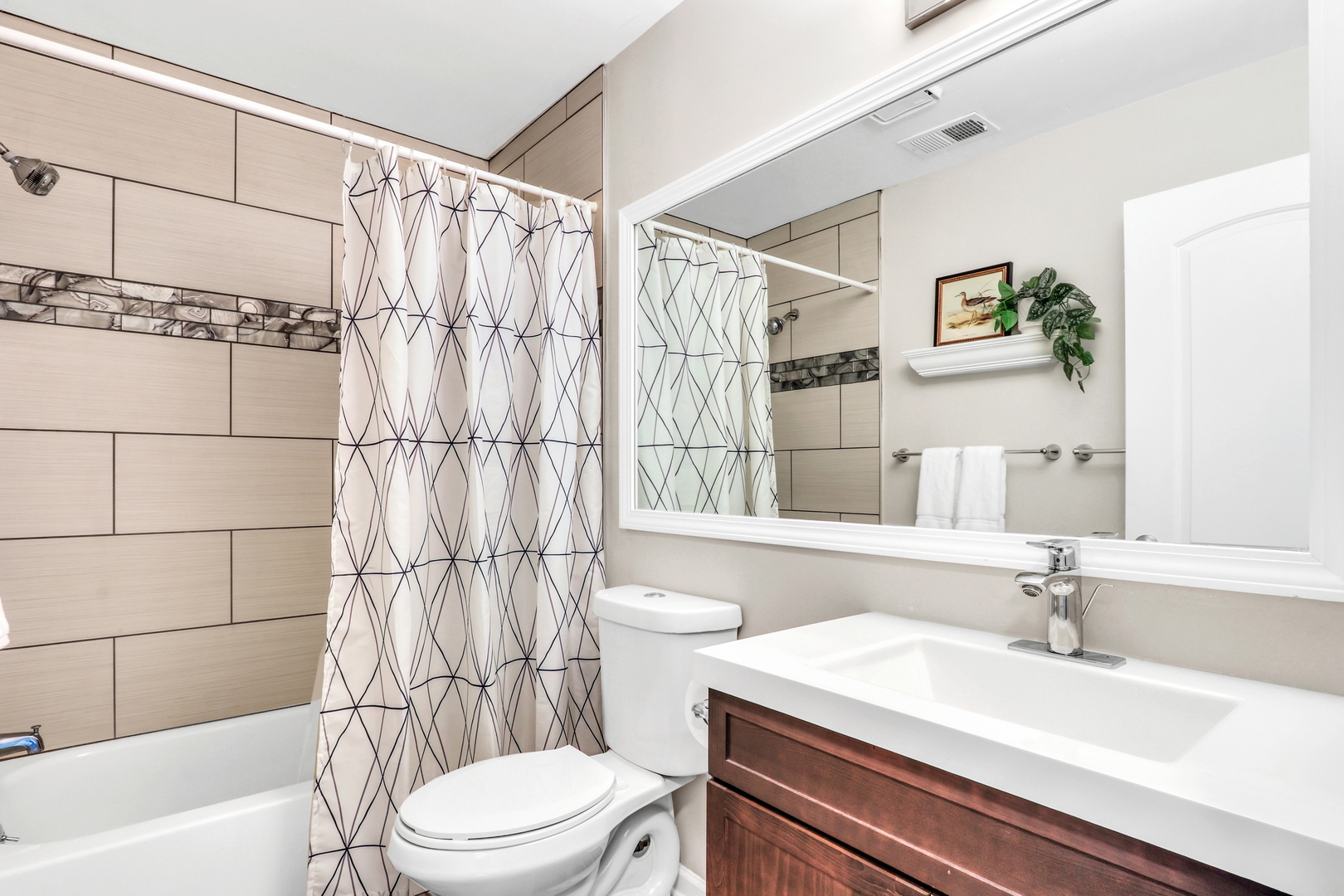 104 East Winchester Road, Unit E Libertyville, IL 60048 - Photo 12 of 23 a bathroom with a sink a toilet and shower