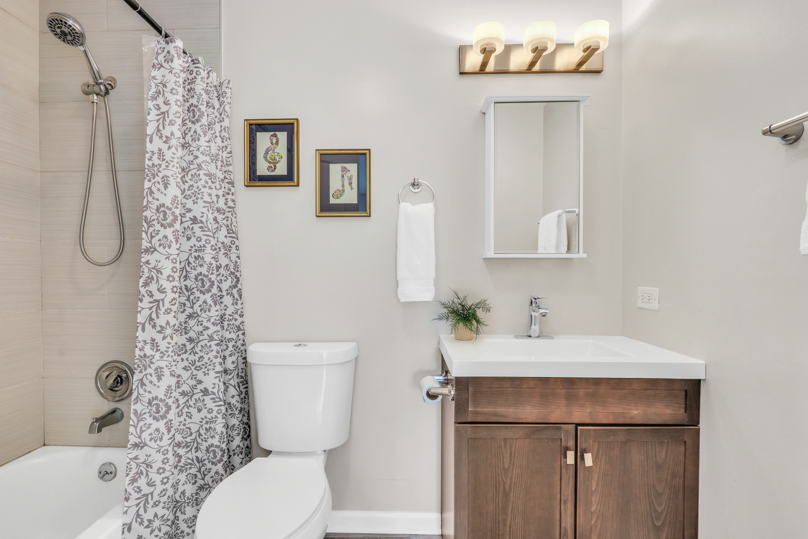 104 East Winchester Road, Unit E Libertyville, IL 60048 - Photo 16 of 23 a bathroom with a sink toilet and shower