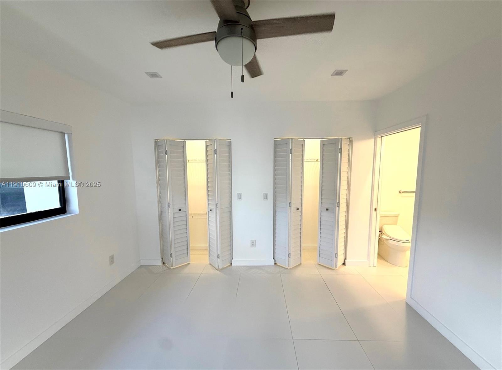 1241 Southwest 30th Place, Unit 1241 Miami, FL 33135 - Photo 7 of 10 a view of an empty room with a window