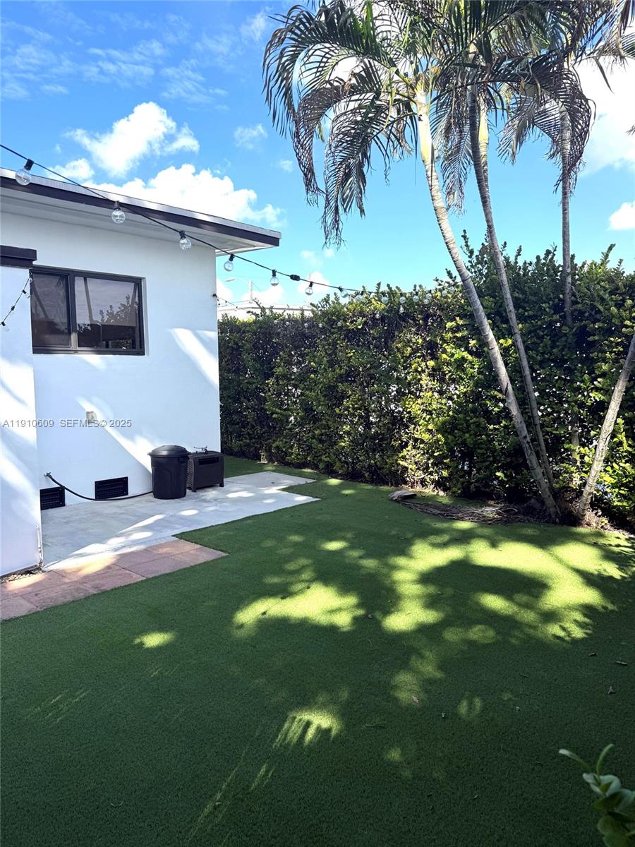 1241 Southwest 30th Place, Unit 1241 Miami, FL 33135 - Photo 9 of 10 a view of a house with a yard