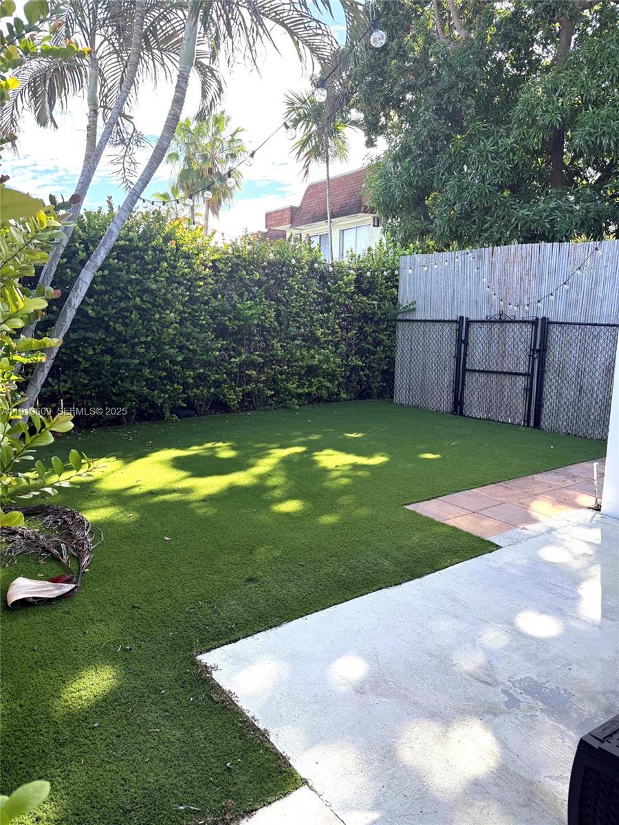 1241 Southwest 30th Place, Unit 1241 Miami, FL 33135 - Photo 10 of 10 a view of a backyard with a garden