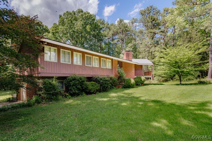 3925 Woodsdale Drive Alberta, VA 23821 - Photo 44 of 50 a front view of house with yard and green space