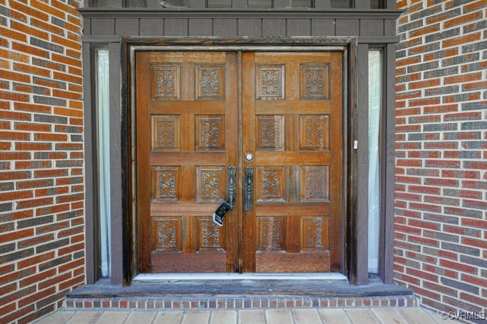 3925 Woodsdale Drive Alberta, VA 23821 - Photo 5 of 50 a view of a brick house with a door
