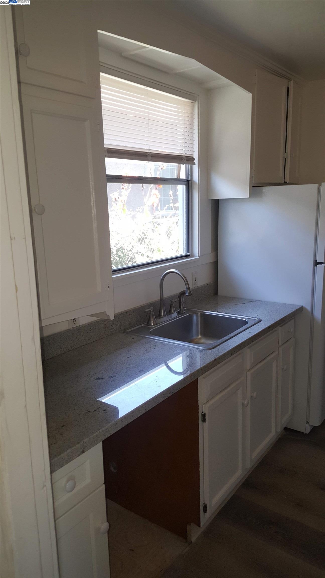 Jefferson Oakland, CA 94601 - Photo 10 of 14 a kitchen with a sink cabinets and a window