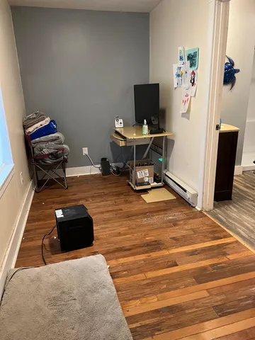 a room with furniture and a flat screen tv