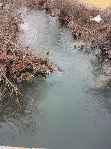 a view of water and mountain view in yard