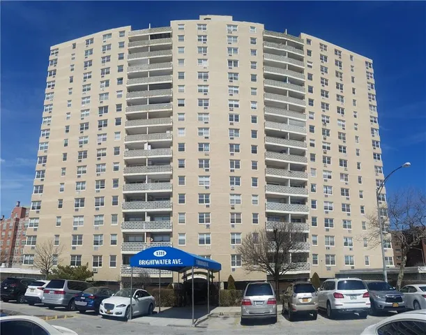 a view of a building with parking space