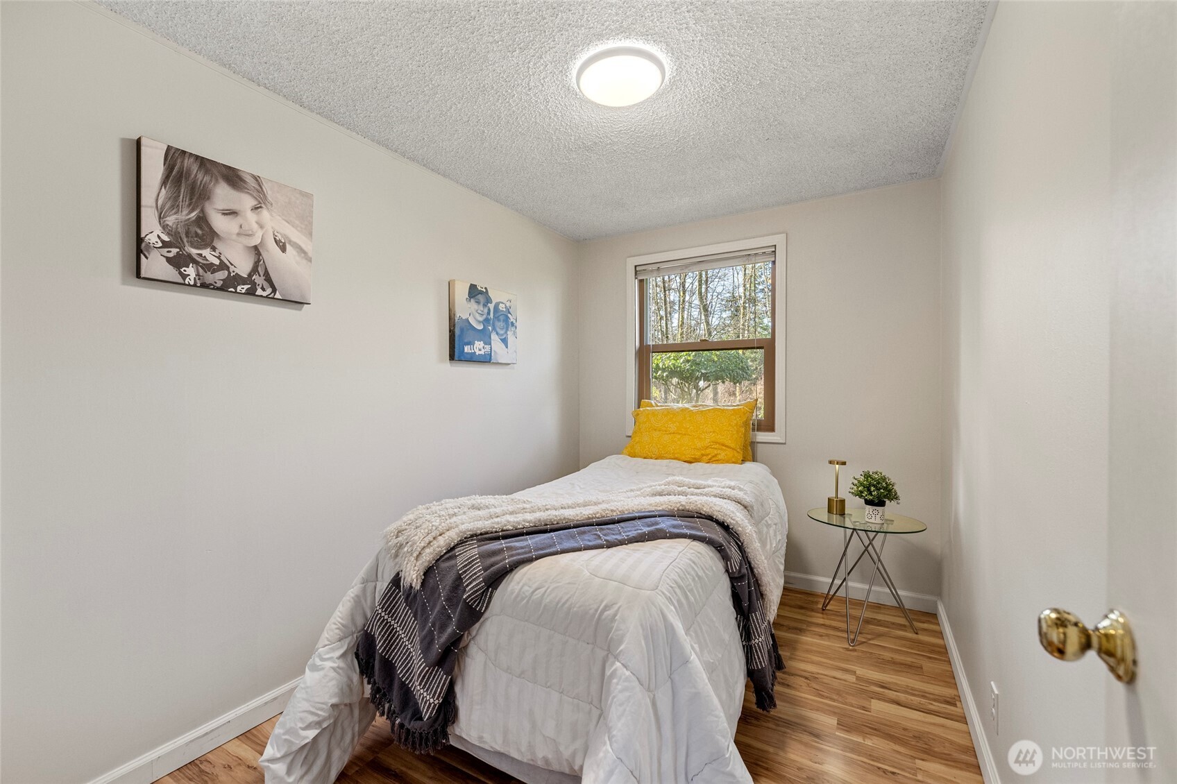 2408 148th Street Southwest Lynnwood, WA 98087 - Photo 15 of 40 a bed sitting in a bedroom next to a window