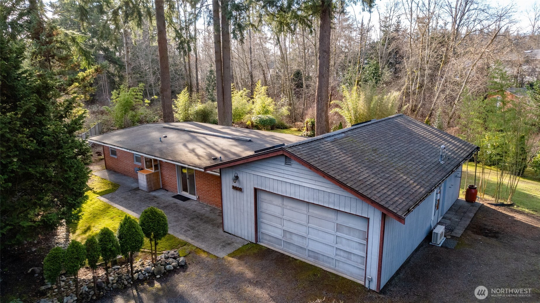 2408 148th Street Southwest Lynnwood, WA 98087 - Photo 24 of 40 a backyard of a house with lots of green space
