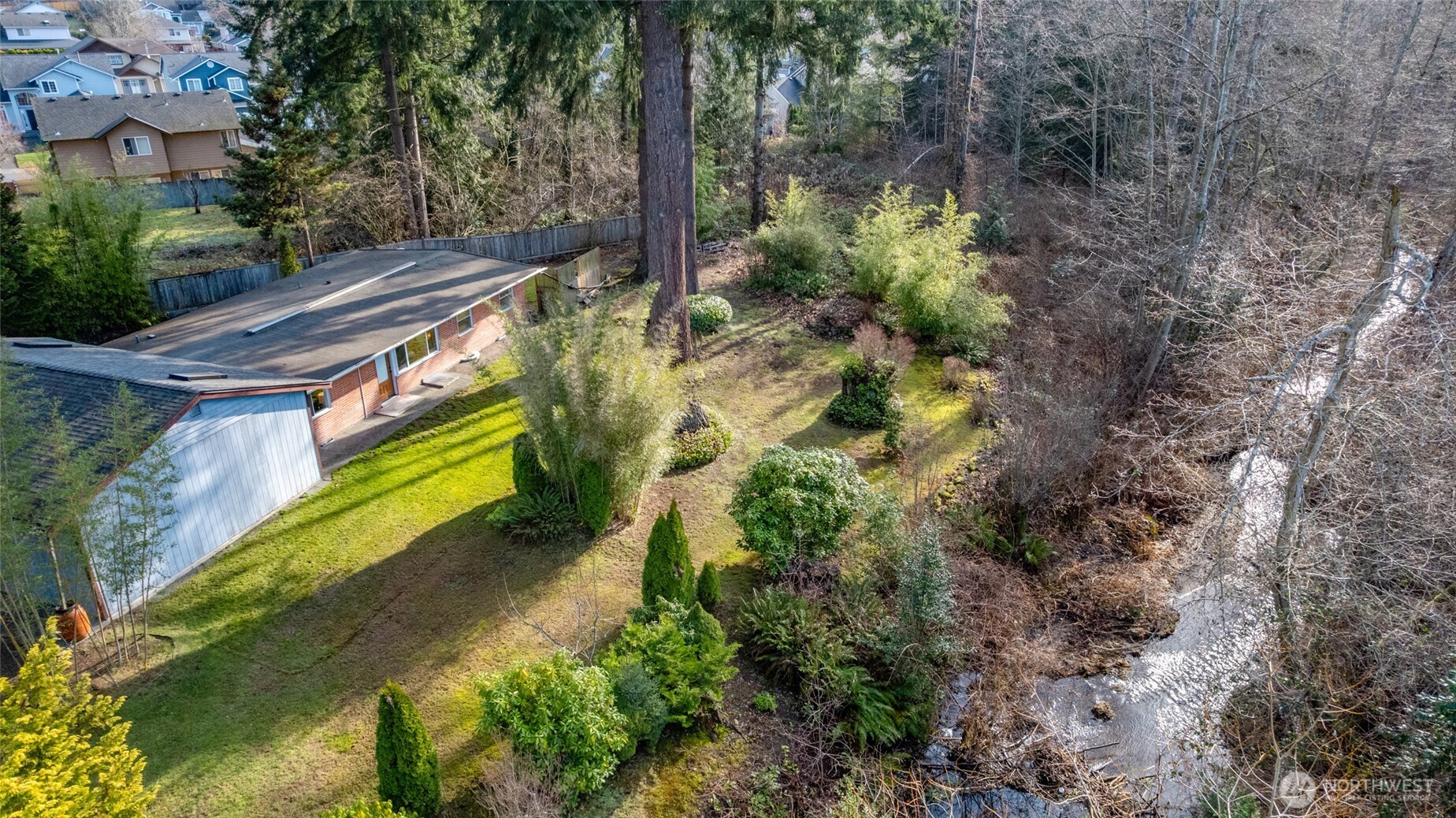 2408 148th Street Southwest Lynnwood, WA 98087 - Photo 25 of 40 a view of a yard with plants
