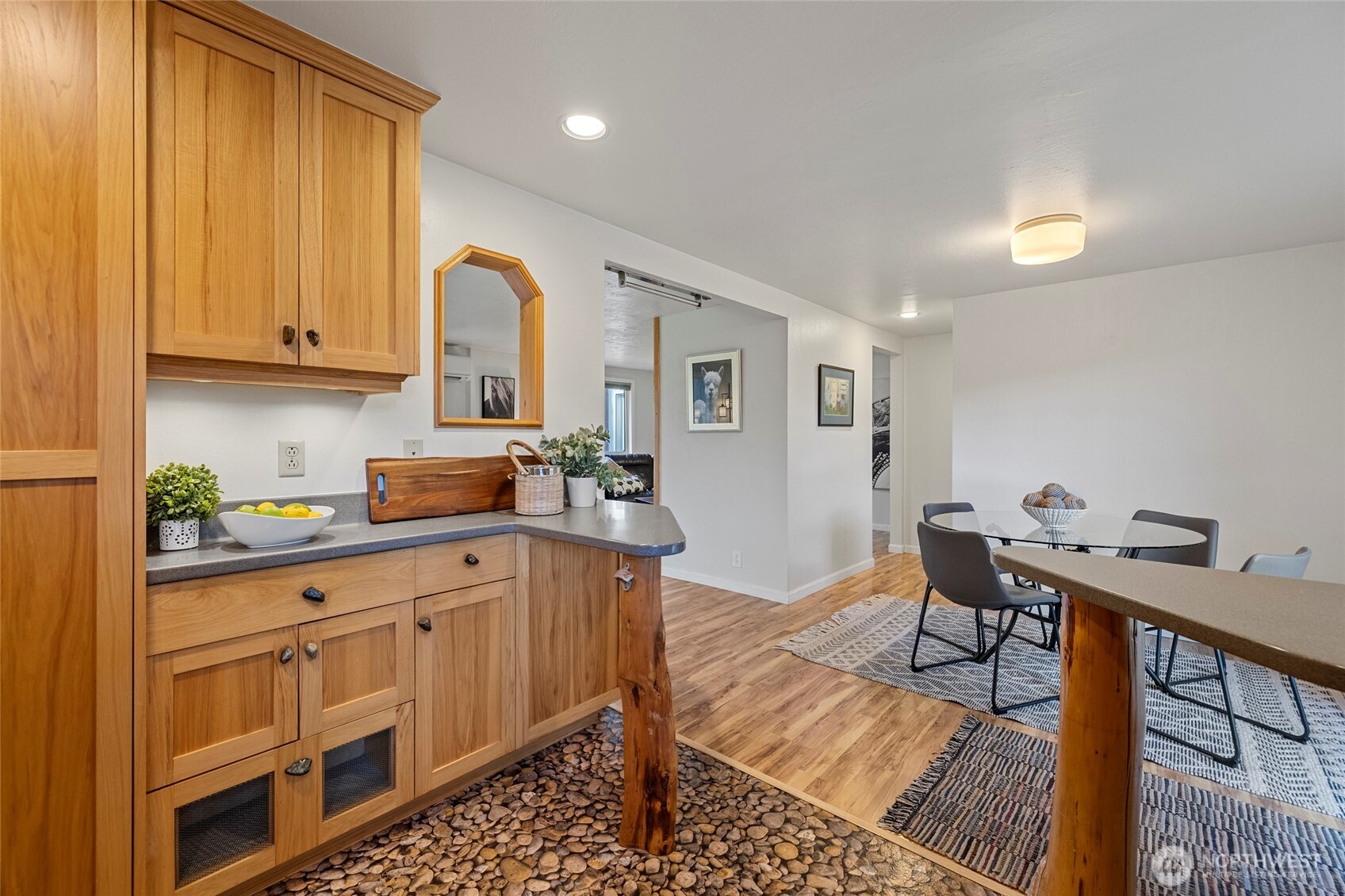 2408 148th Street Southwest Lynnwood, WA 98087 - Photo 6 of 40 a kitchen with sink cabinets and wooden floor