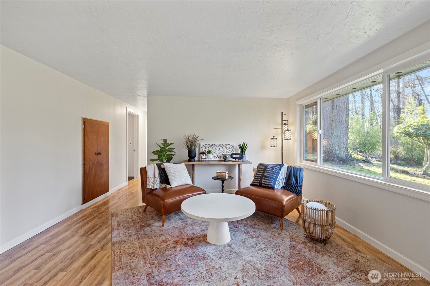 2408 148th Street Southwest Lynnwood, WA 98087 - Photo 9 of 40 a living room with furniture a window and a potted plant