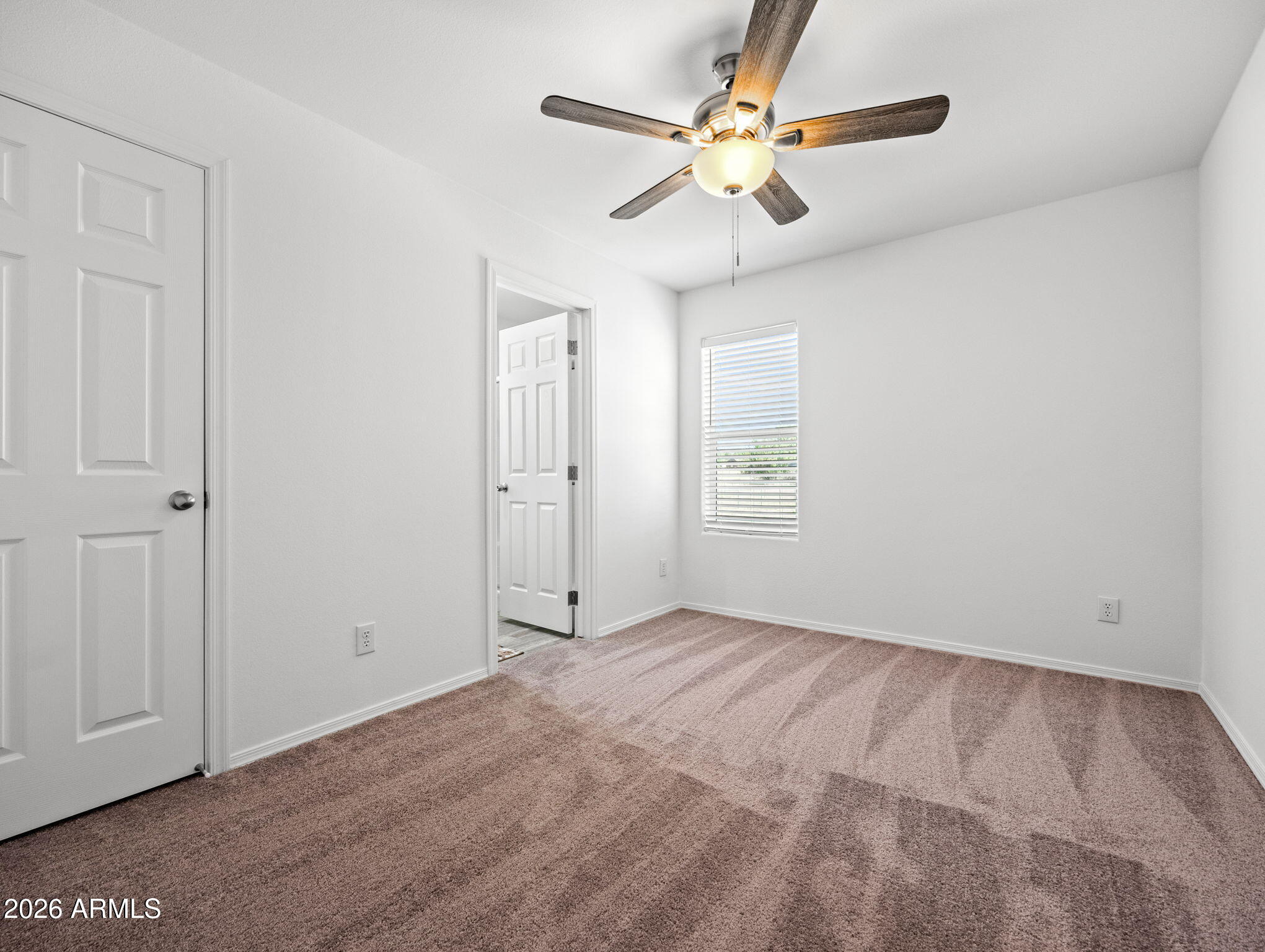18296 Frontier Road Peeples Valley, AZ 86332 - Photo 22 of 44 a view of an empty room with a window