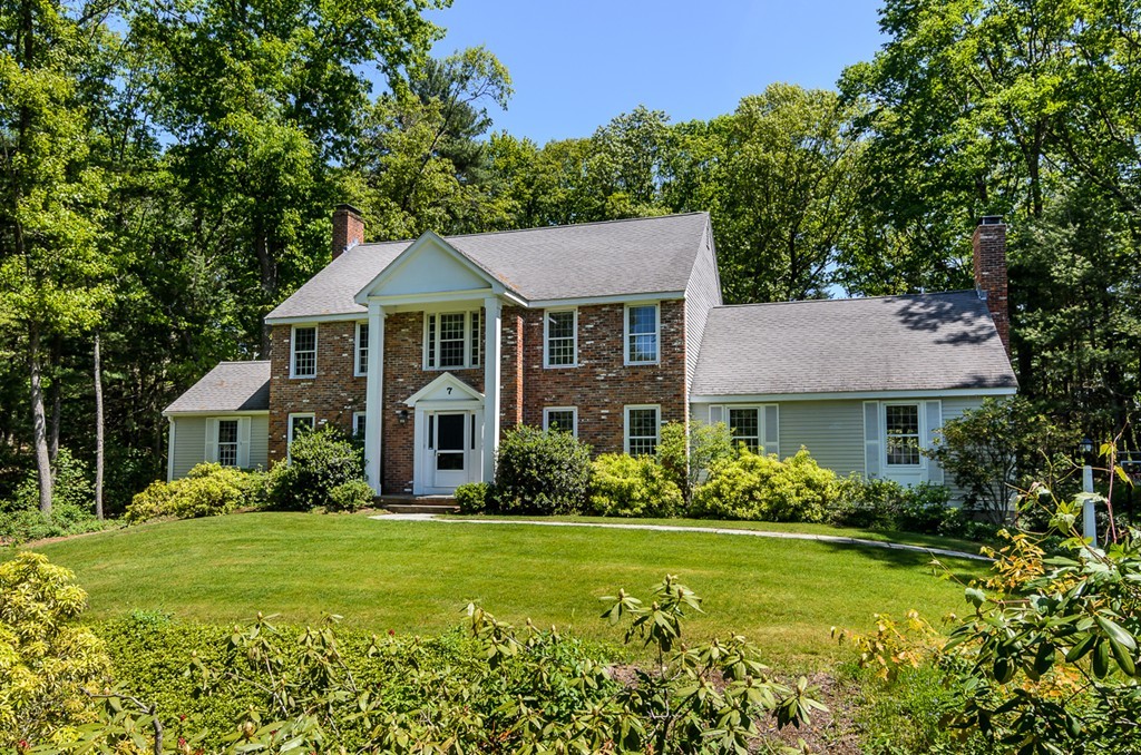7 Folsoms Pond Road Wayland, MA 01778 - Photo 1 of 18 a front view of a house with garden