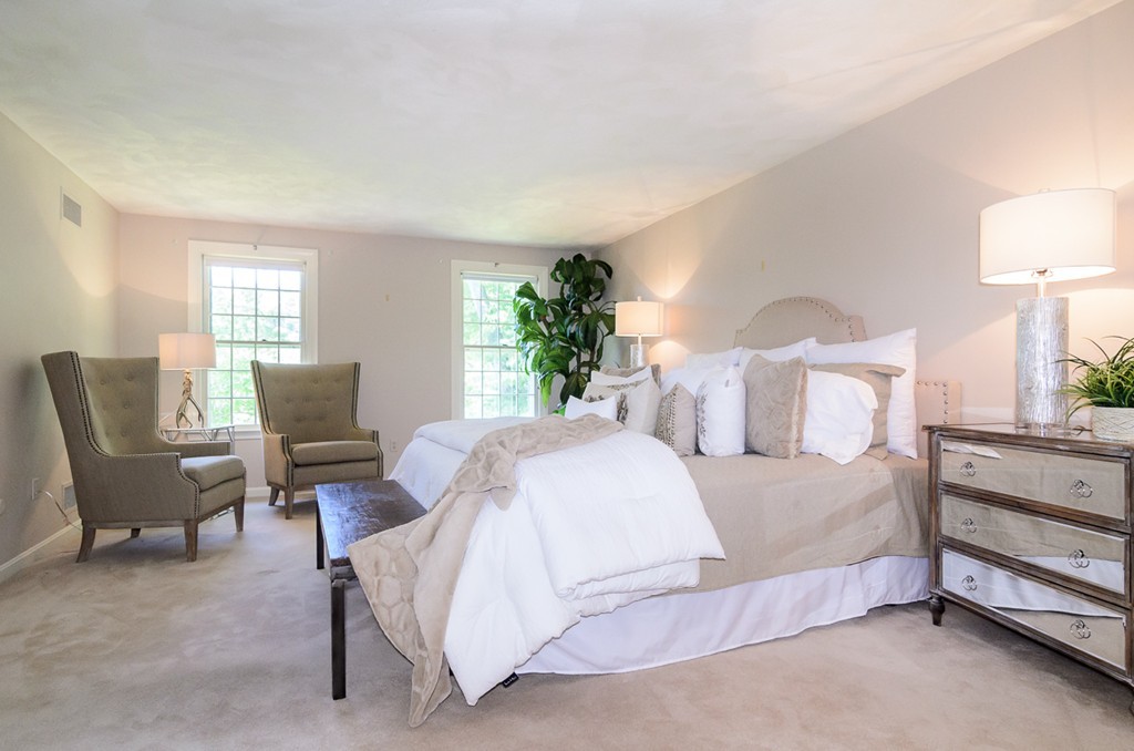 7 Folsoms Pond Road Wayland, MA 01778 - Photo 12 of 18 a bedroom with a bed chair and lamp