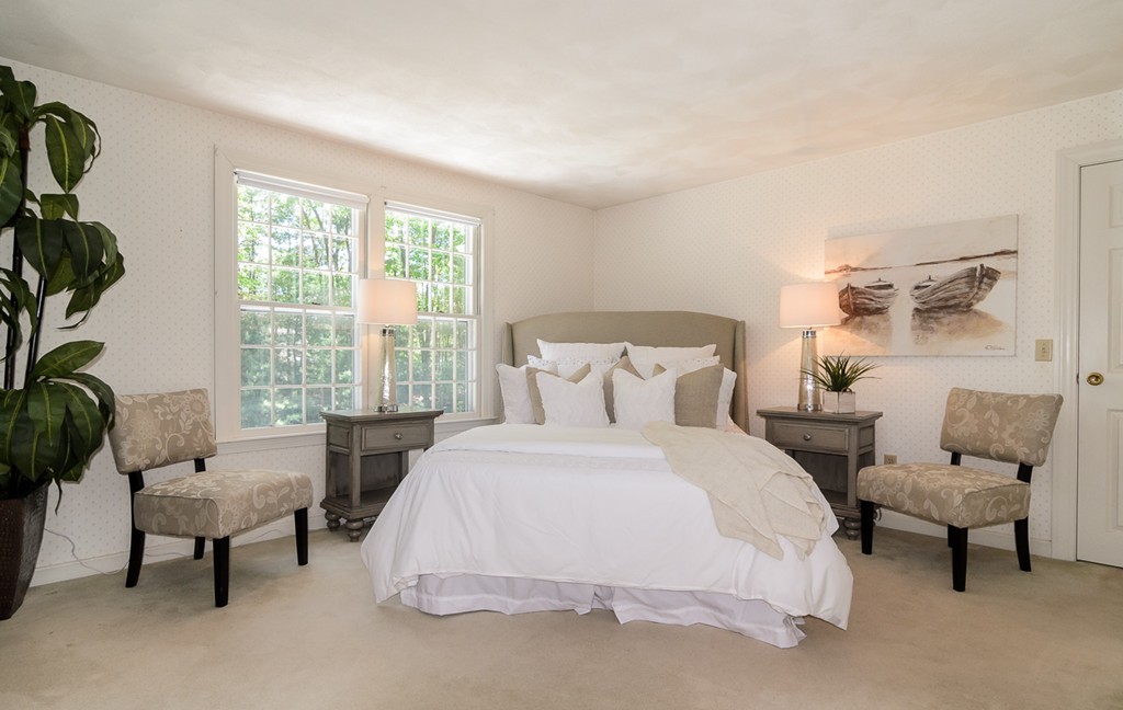 7 Folsoms Pond Road Wayland, MA 01778 - Photo 13 of 18 a bedroom with furniture and a large window