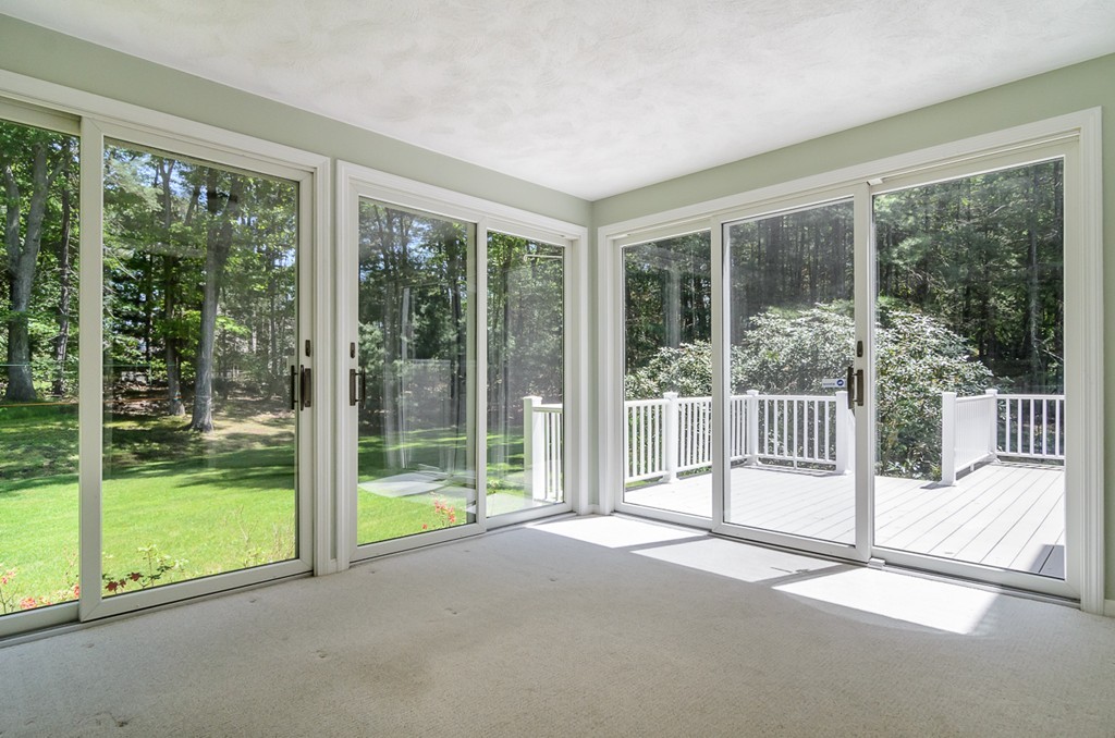 7 Folsoms Pond Road Wayland, MA 01778 - Photo 15 of 18 a view of a room with balcony and a floor to ceiling window