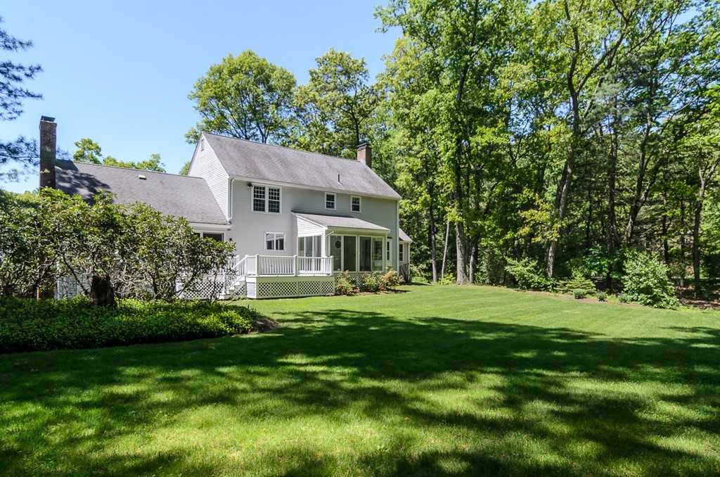 7 Folsoms Pond Road Wayland, MA 01778 - Photo 17 of 18 a front view of a house with a garden