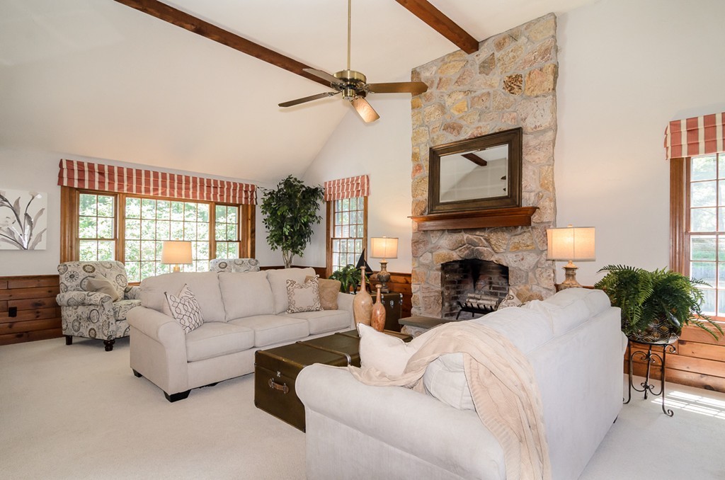 7 Folsoms Pond Road Wayland, MA 01778 - Photo 5 of 18 a living room with furniture a fireplace and a large window