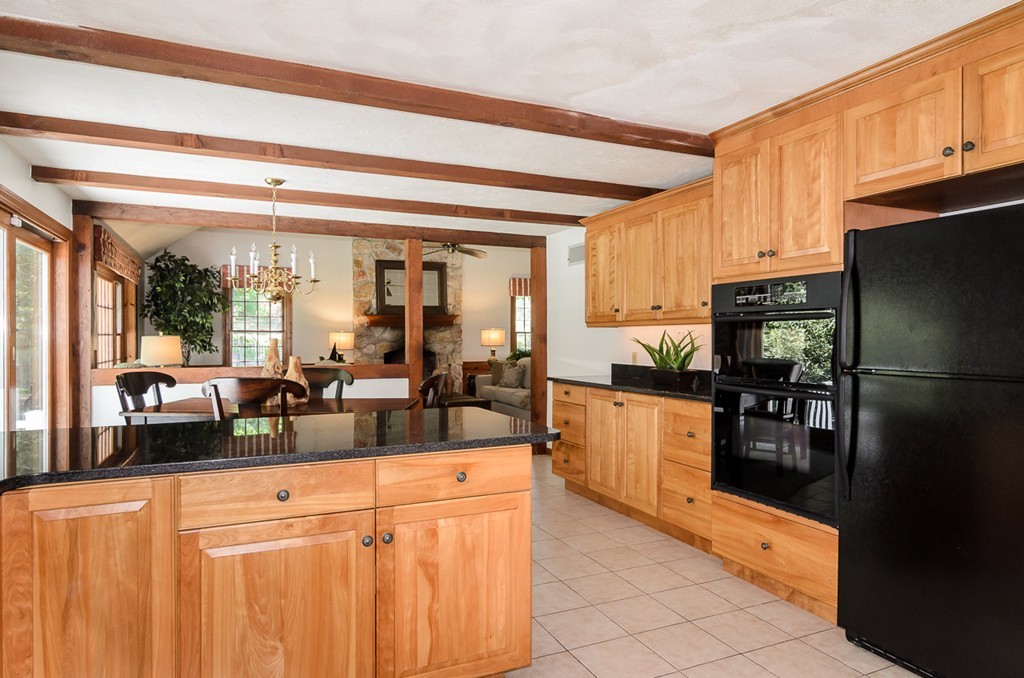 7 Folsoms Pond Road Wayland, MA 01778 - Photo 6 of 18 a kitchen with stainless steel appliances granite countertop a refrigerator and a sink