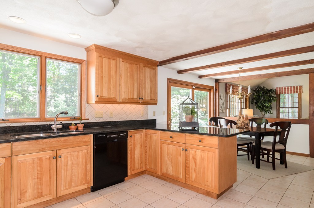 7 Folsoms Pond Road Wayland, MA 01778 - Photo 7 of 18 a kitchen with a sink and cabinets