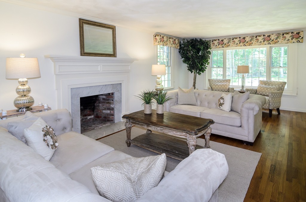7 Folsoms Pond Road Wayland, MA 01778 - Photo 9 of 18 a living room with furniture and a fireplace