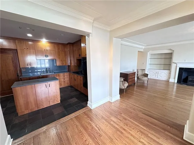 a large kitchen with a large counter top appliances and cabinets