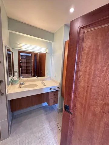 a view of room with a sink and mirror