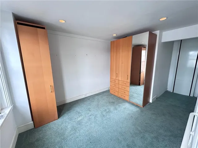 a large room with a lot of counter space and sink