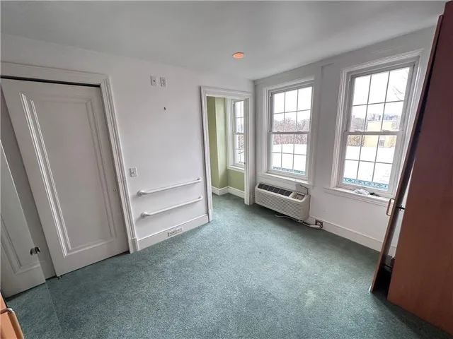 a large kitchen with a sink and cabinets