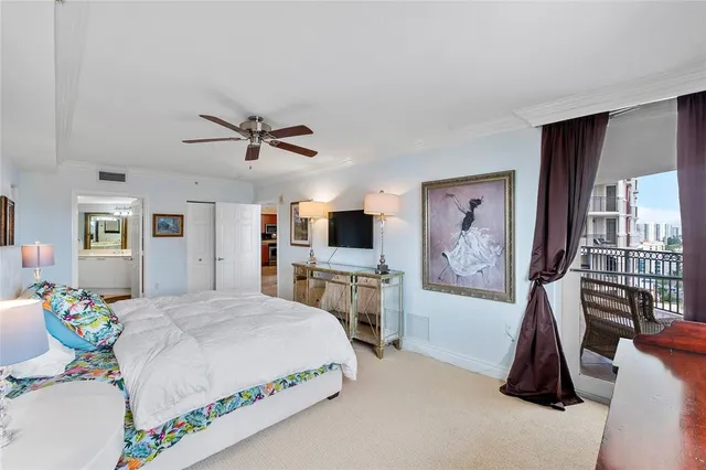a bathroom with a tub a sink double vanity and a mirror