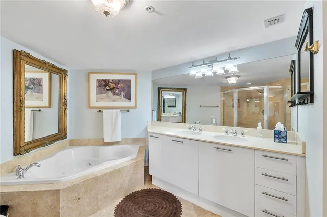 a bathroom with a glass shower door