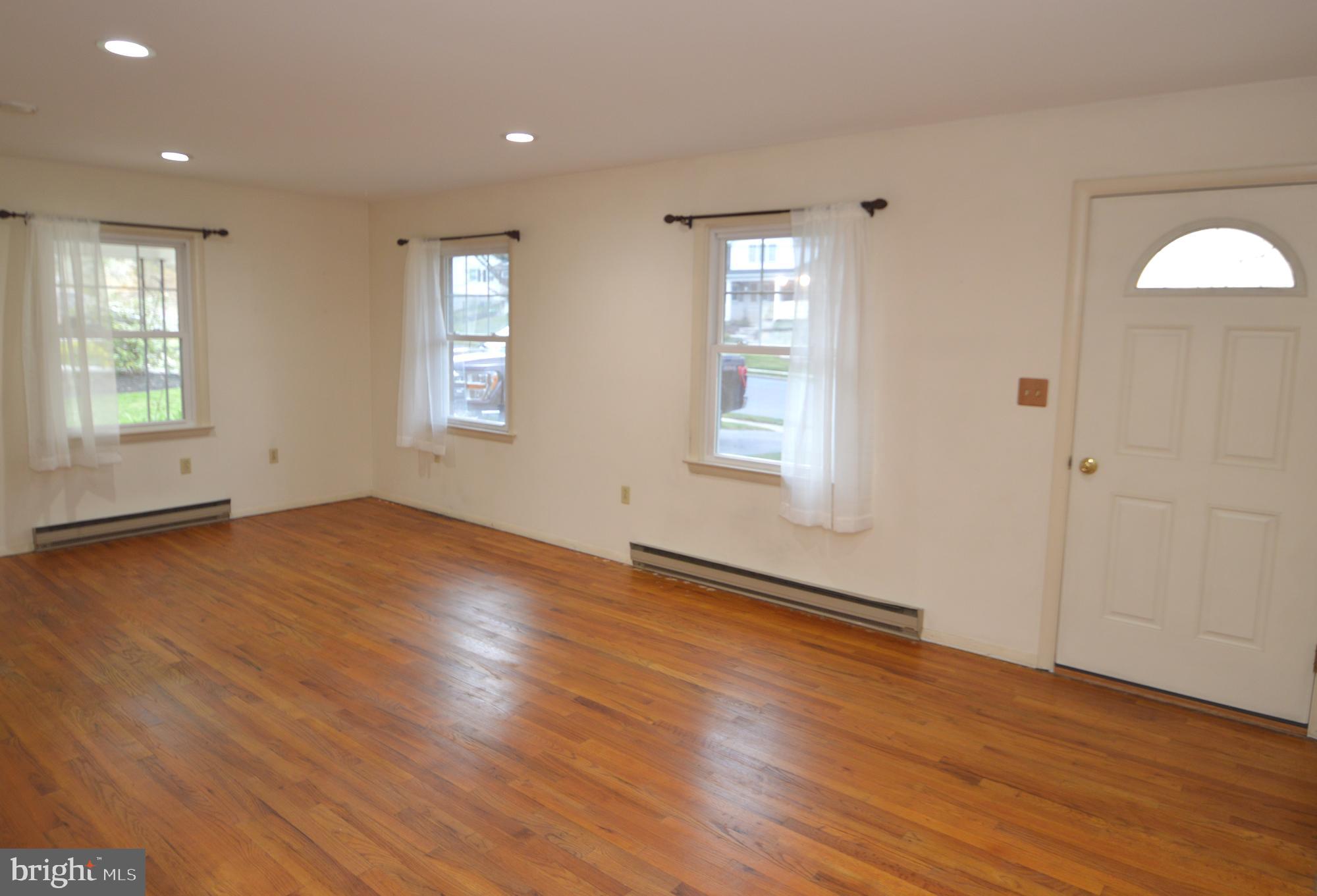 401 Lemon Street Elizabethtown, PA 17022 - Photo 12 of 39 an empty room with wooden floor and windows