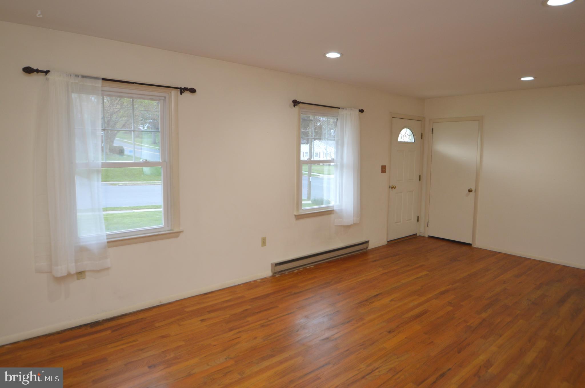 401 Lemon Street Elizabethtown, PA 17022 - Photo 13 of 39 a view of an empty room with wooden floor and a window