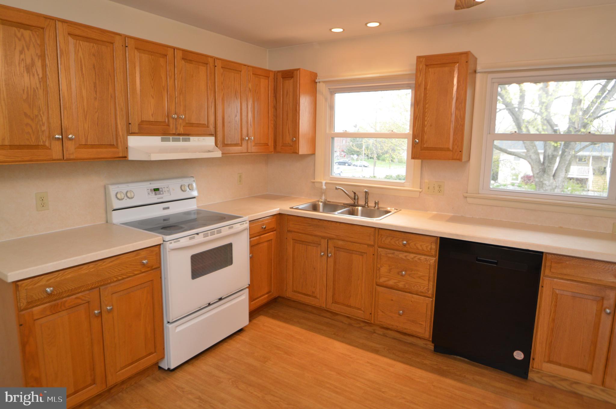 401 Lemon Street Elizabethtown, PA 17022 - Photo 14 of 39 a kitchen with a white stove top oven sink and window