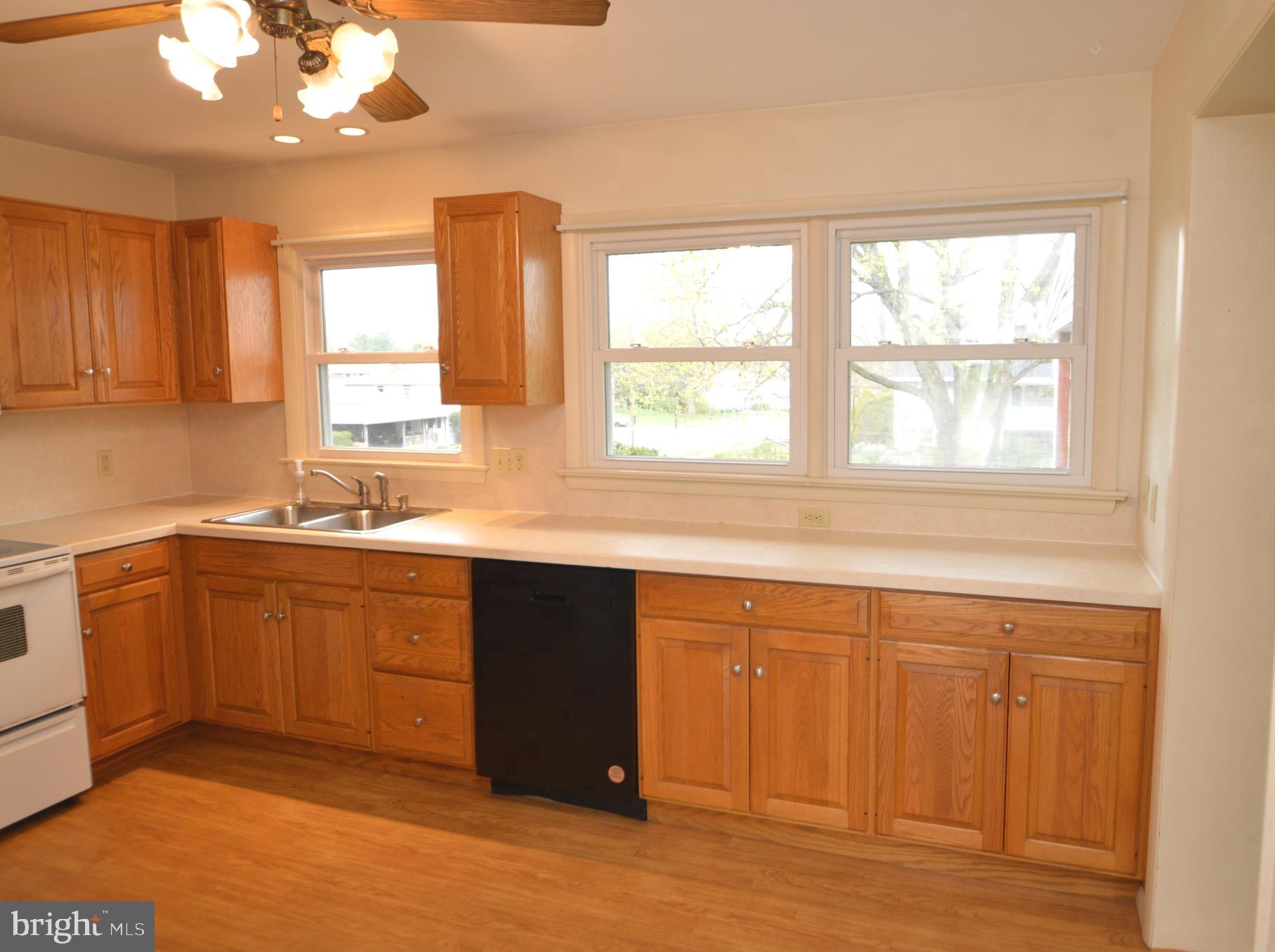 401 Lemon Street Elizabethtown, PA 17022 - Photo 16 of 39 a kitchen with stainless steel appliances granite countertop a sink cabinets and wooden floor