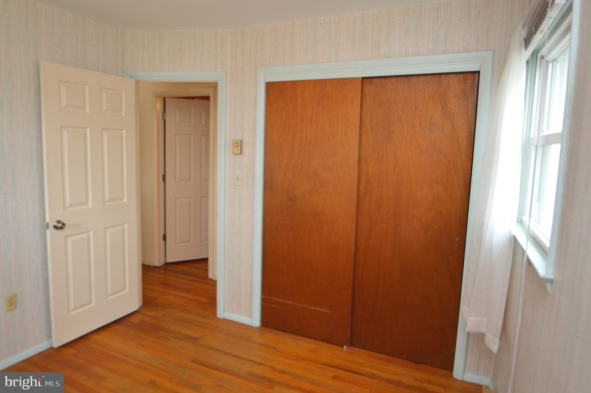 401 Lemon Street Elizabethtown, PA 17022 - Photo 21 of 39 an empty room with wooden floor and closet area