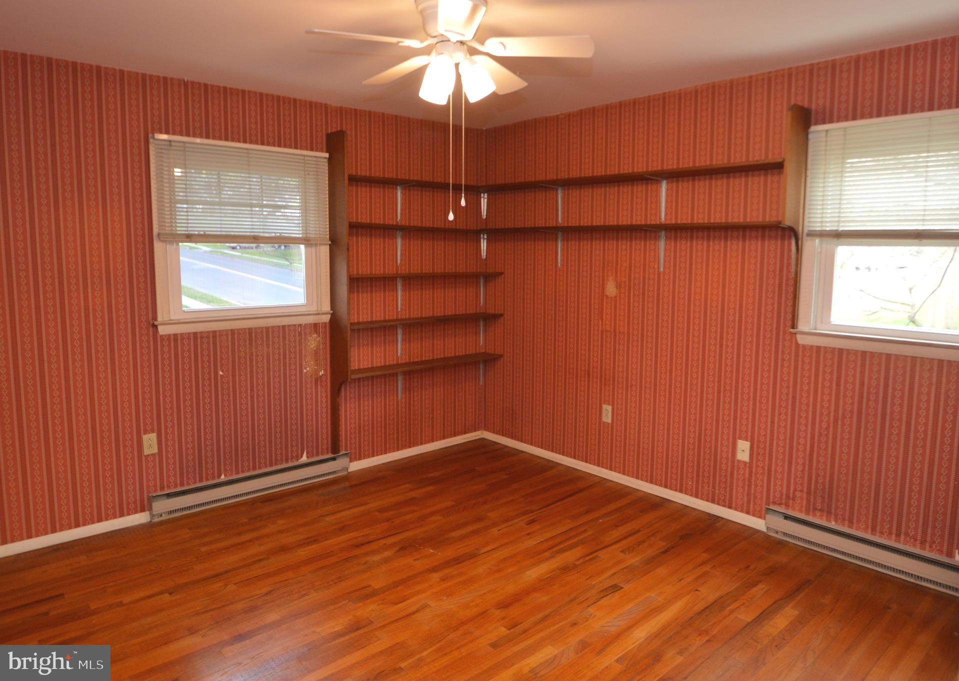 401 Lemon Street Elizabethtown, PA 17022 - Photo 22 of 39 an empty room with windows and chandelier fan