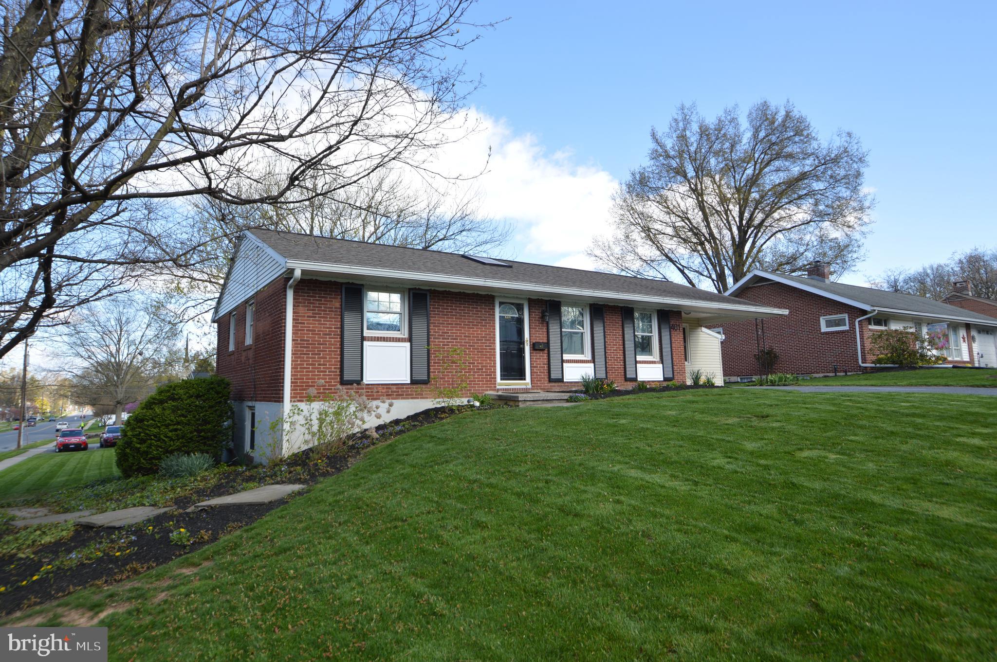 401 Lemon Street Elizabethtown, PA 17022 - Photo 36 of 39 a view of a yard in front of a house with plants and large tree
