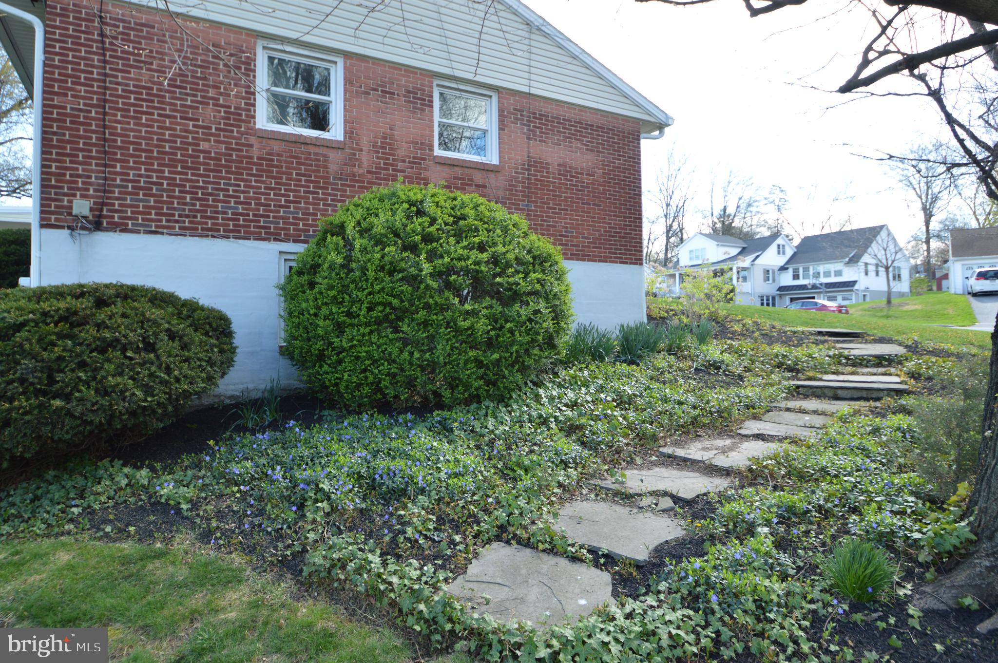 401 Lemon Street Elizabethtown, PA 17022 - Photo 6 of 39 a view of a brick house next to a yard