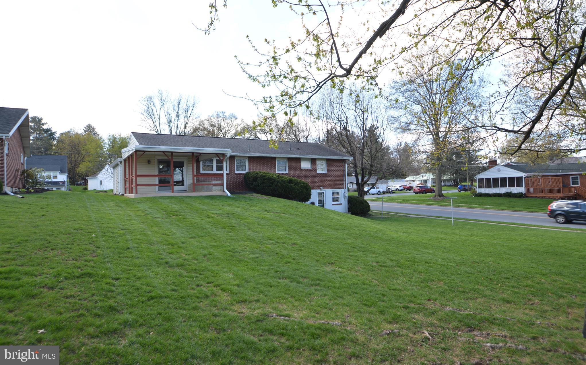 401 Lemon Street Elizabethtown, PA 17022 - Photo 7 of 39 a view of a house with a big yard and large trees