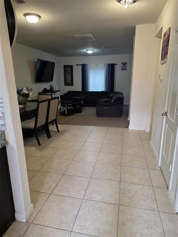 3009 Earl Road Anna, TX 75409 - Photo 2 of 9 a living room with furniture and a flat screen tv